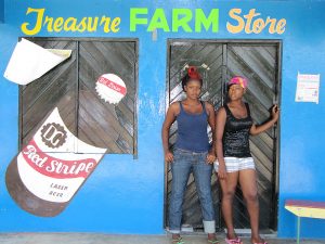 The Jamaican vision of beauty keeps evolving. "Most of the young girls now coming up ? they don't want fat no more, they want slim and trim," says farmer Kadesha Abrahms (left) at a feed store in Treasure Beach, Jamaica. (Image: Davia Nelson for NPR)  