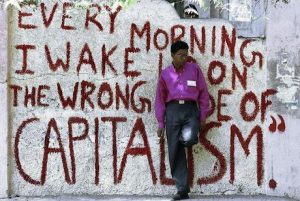 Every morning I wake up on the wrong side of capitalism. Credit: Street Art Utopia, Sun Rise Above.