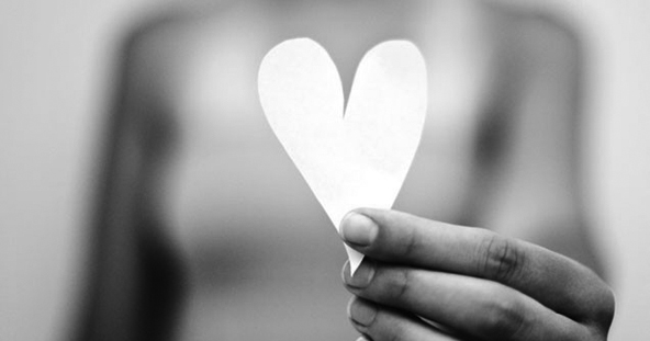hand holding a paper heart
