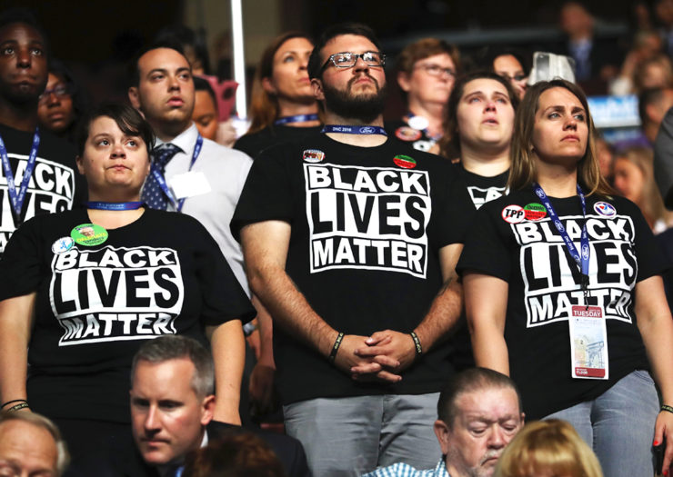 White supporters of Black Lives Matter movement stand during event