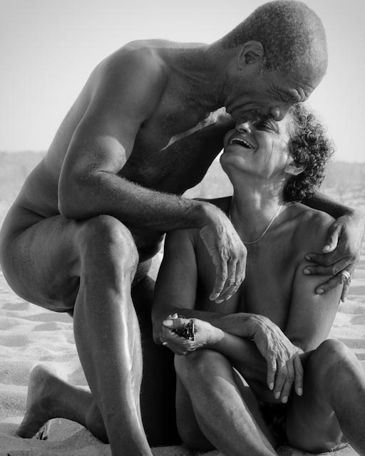 Elderly couple on beach.
